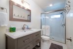 The hall bathroom is shared by the 2nd and 3rd bedrooms and features a step in shower